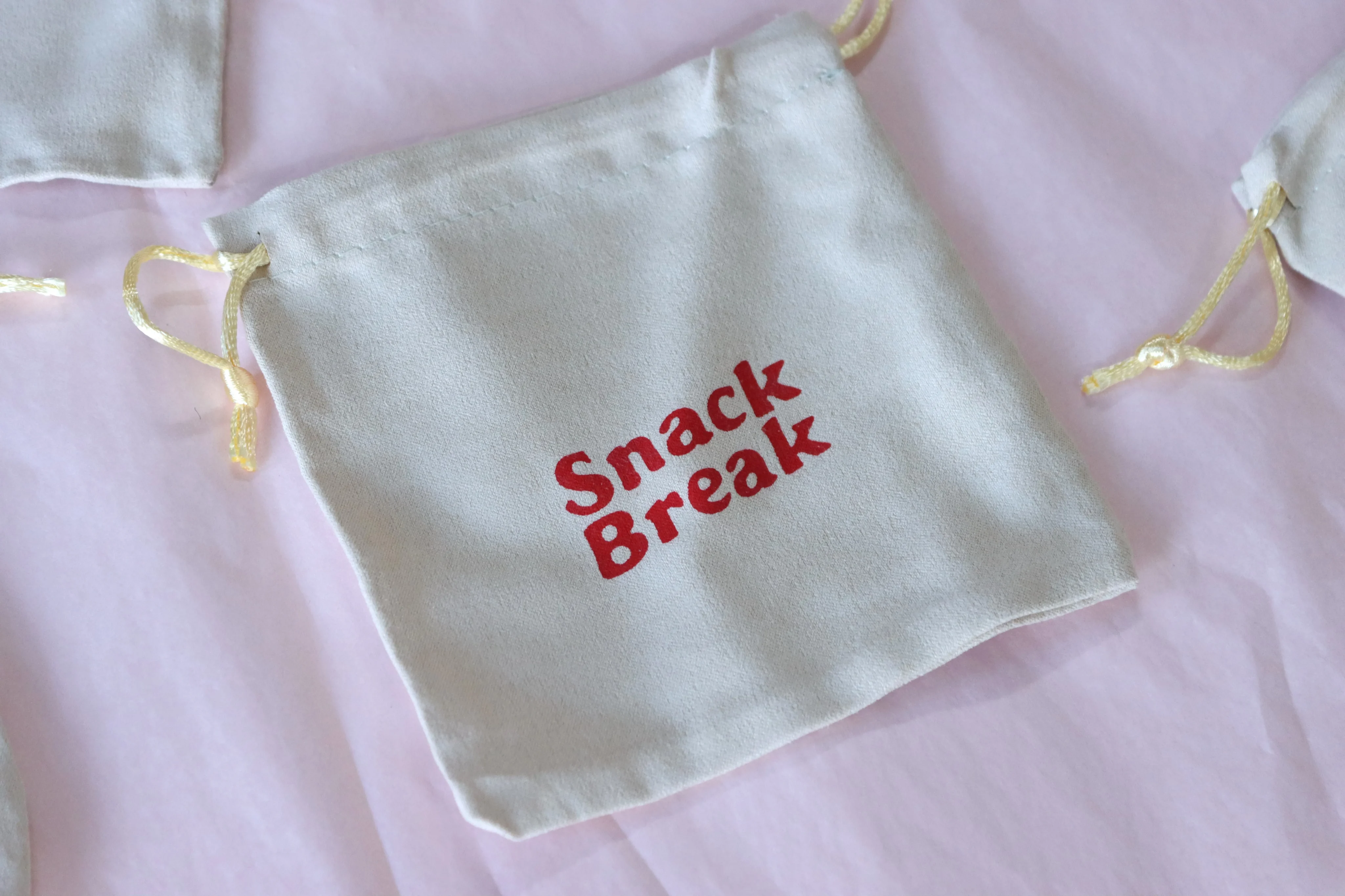 branded ecommerce packaging fabric bag with logo as part of packaging elements