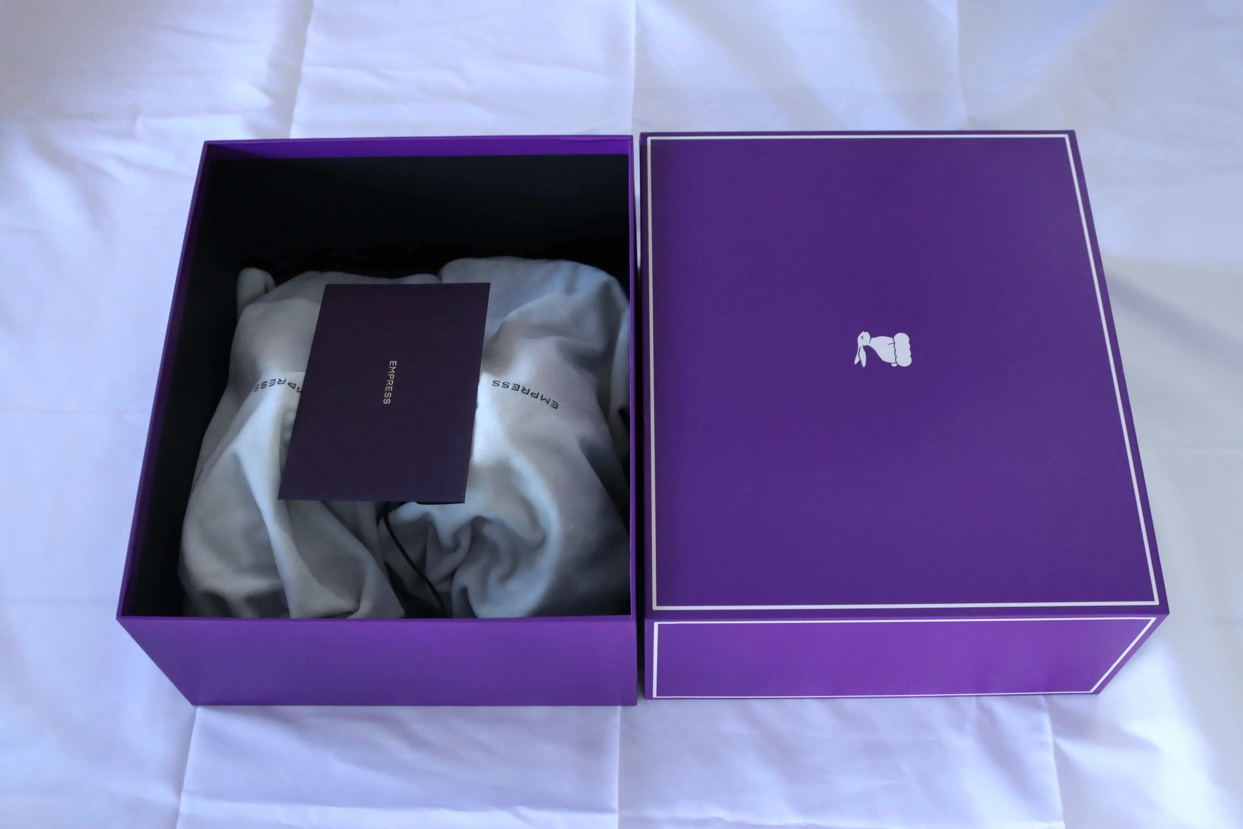 customer unboxing branded ecommerce package at home