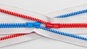 Red and blue molded teeth showing one of the zipper types for bags