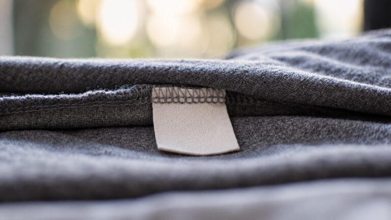 Blank sewn-in garment tag and seam showing an attachment position for care labels