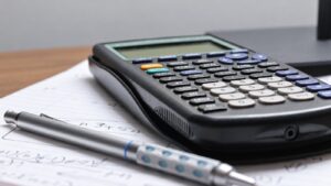 Calculator and written working used to plan dropshipping cash flow