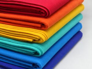 Folded fabrics in six colors illustrating color choices in a minimum order quantity quote