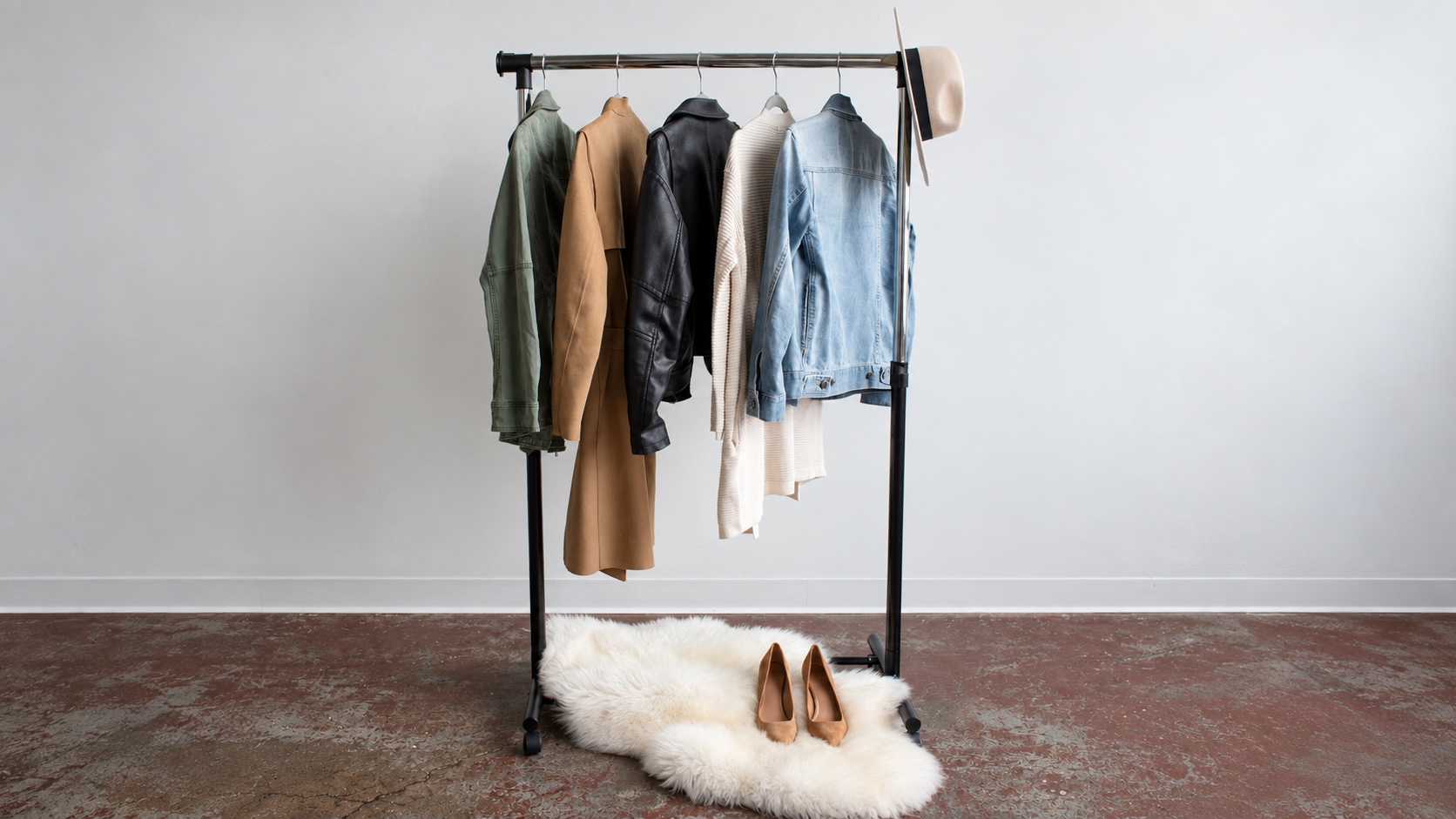 Five garments on a rack illustrating product mix when comparing supplier defect rates