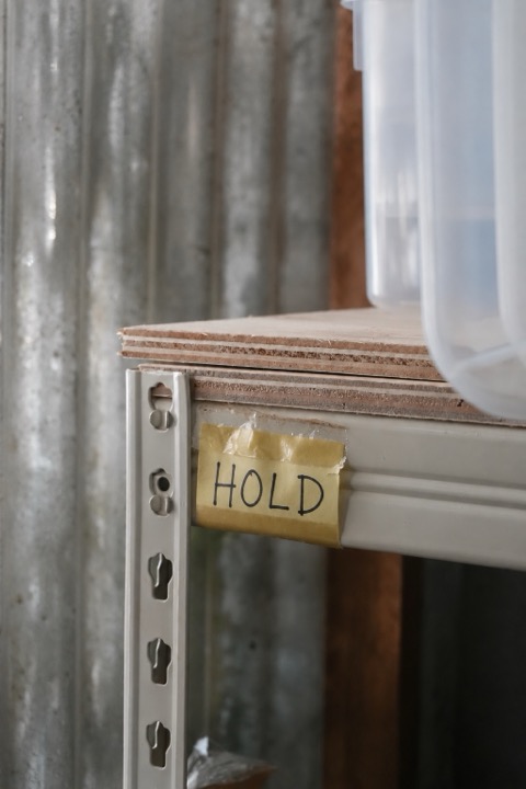 Example HOLD label on a storage shelf