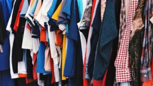 Row of assorted shirts hanging side by side