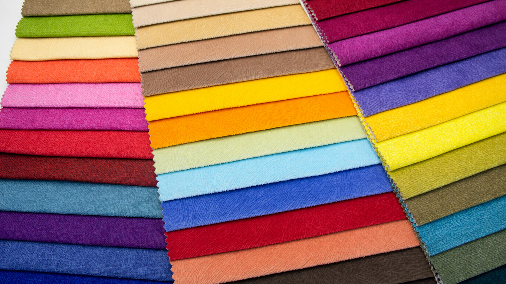Rows of overlapping fabric swatches with pinked edges