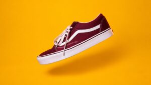 Product photo delivery illustrated by a complete burgundy shoe with space around its outline