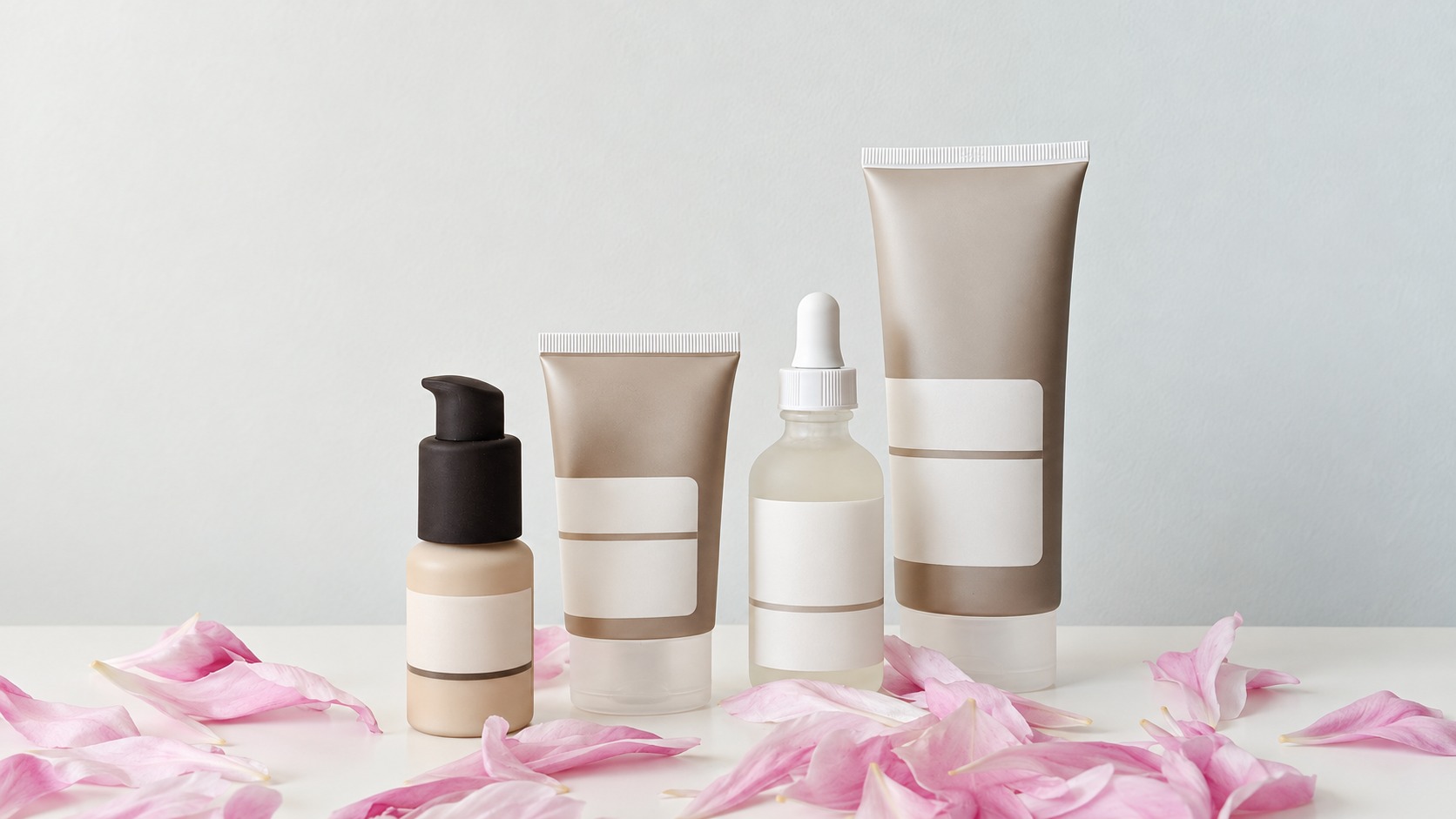 Product sample illustration showing four distinct cosmetic containers in a collection