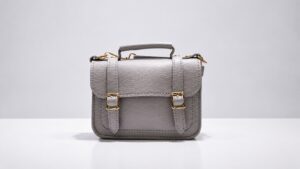 Front view of a gray bag with a top handle, showing why bag strap length cannot be judged from this view