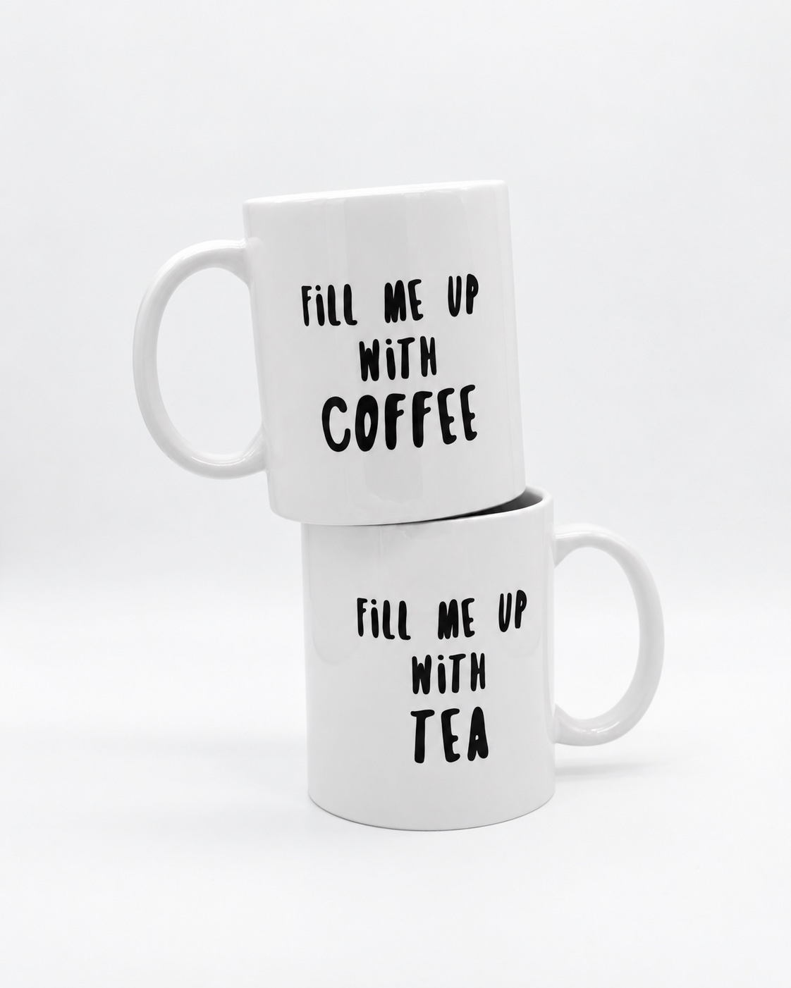 Two ceramic mugs stacked with hard surfaces touching, a display arrangement rather than recommended shipping packaging