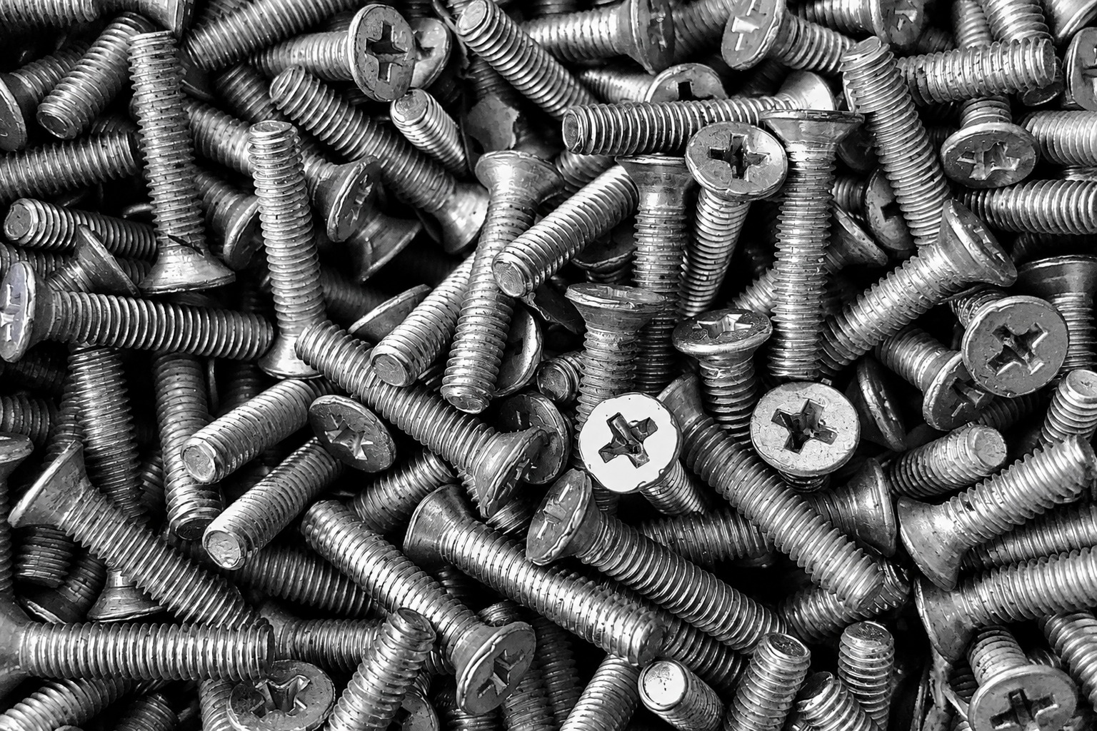 Pile of metal screws illustrating why a component must be identified for the original product