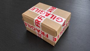 Sealed parcel with fragile tape illustrating unshipped orders