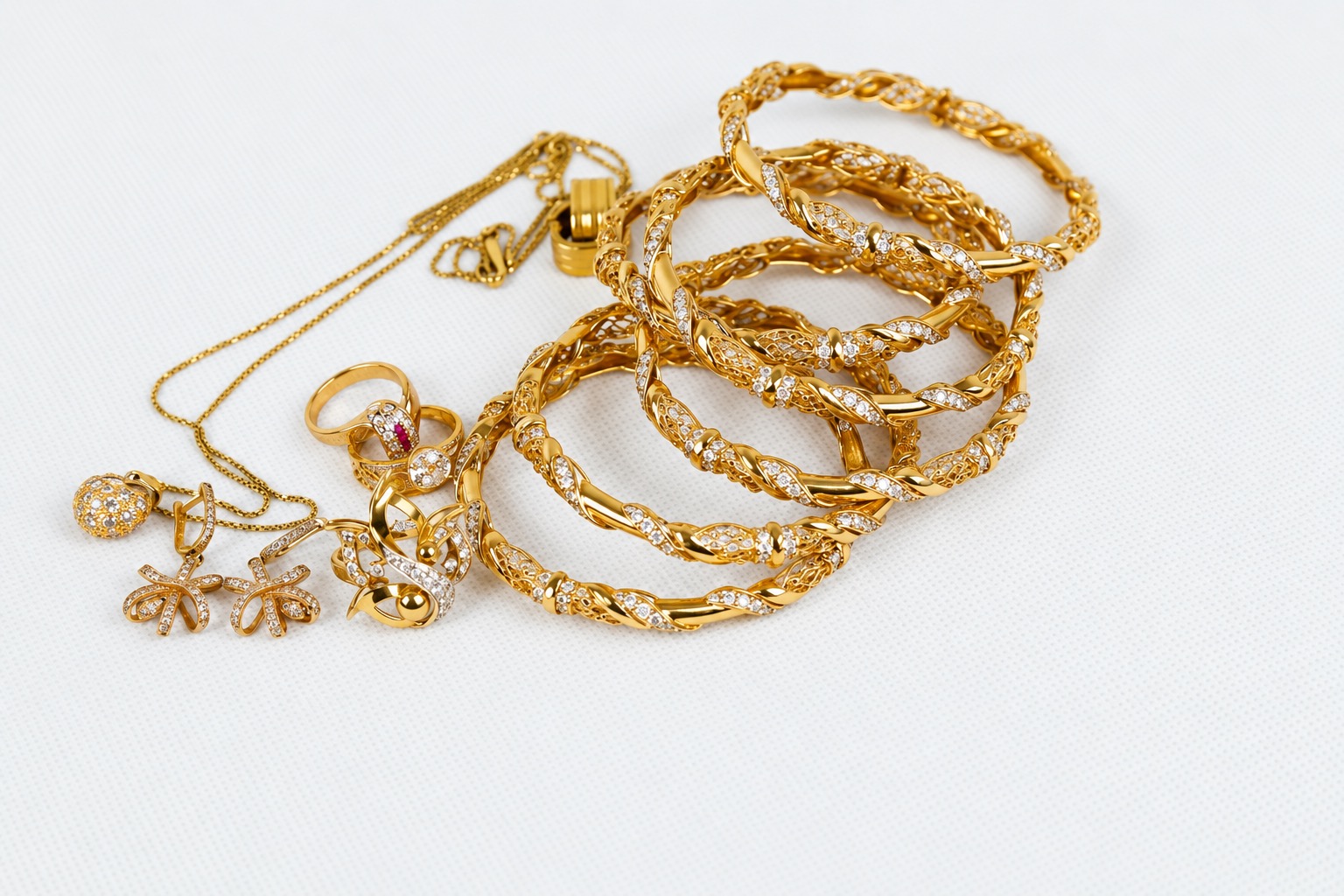 Gold-colored chains and pendants showing separate links, clasps and settings