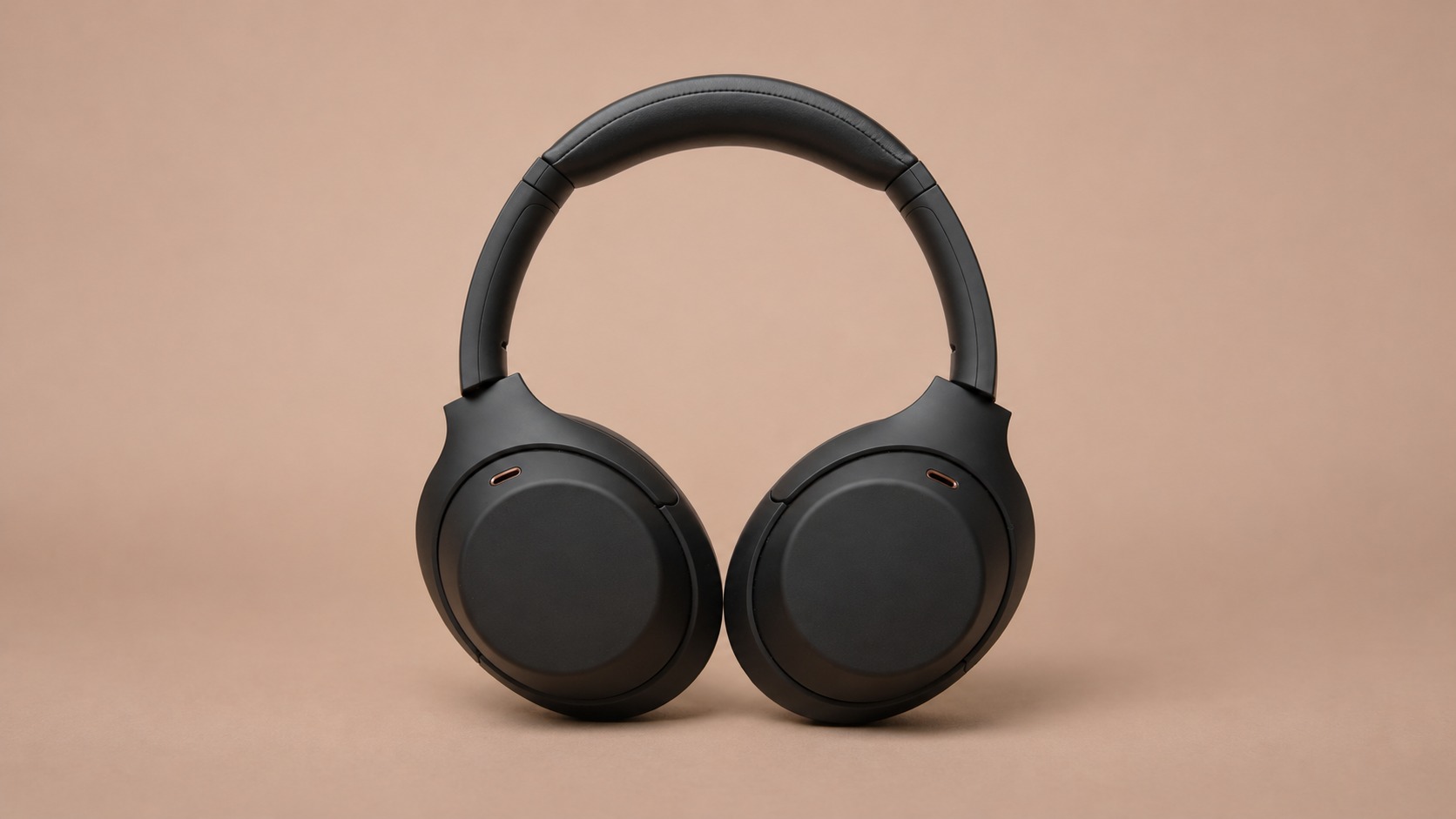 Black headphones against a neutral backdrop illustrating how AI product images can show an item without suggesting wet use