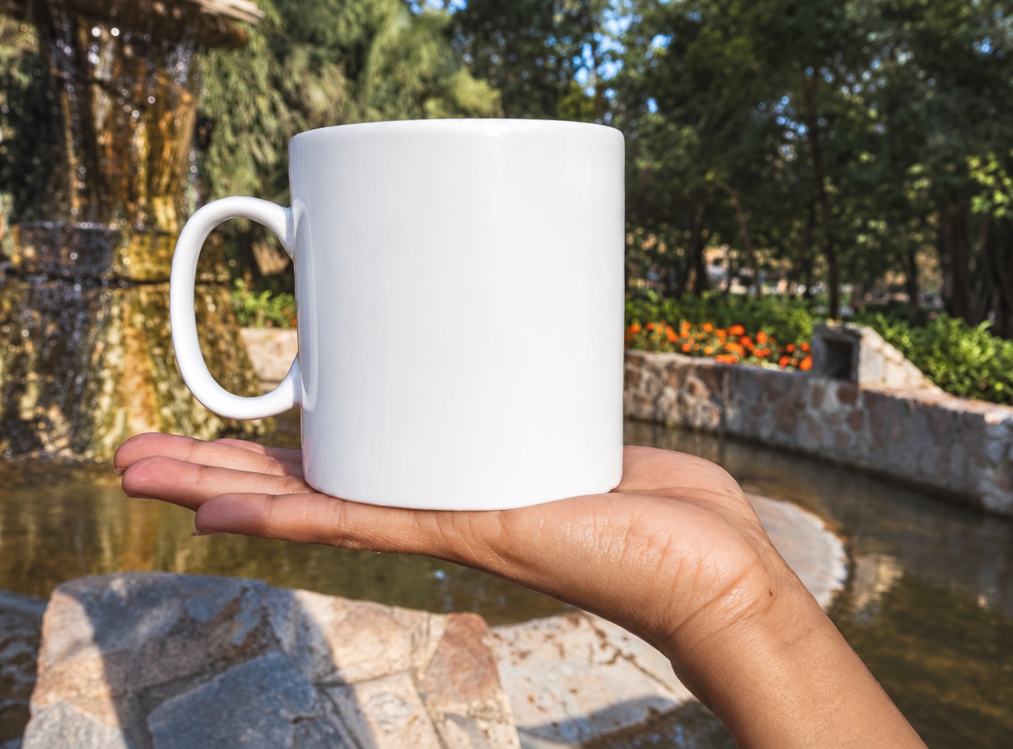 White mug resting on an open palm as a rough size reference rather than a capacity measurement