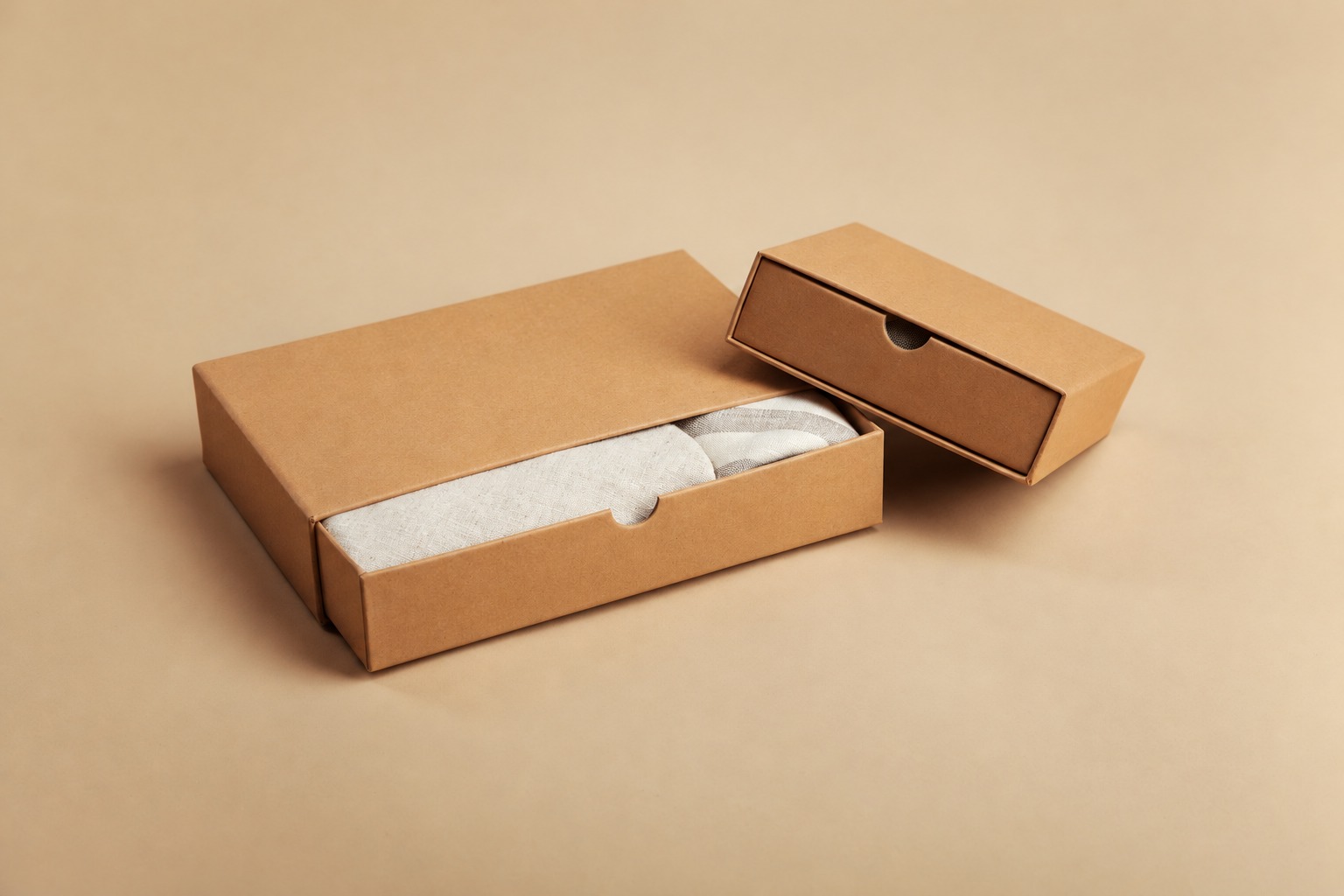 Two plain drawer-style kraft boxes illustrating presentation packaging rather than proven transport protection