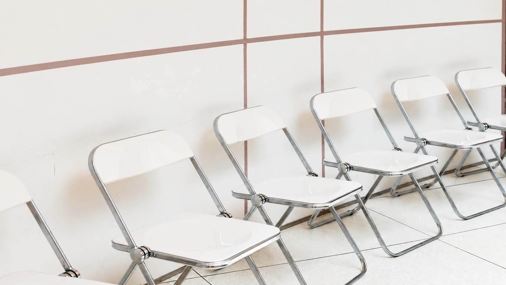 White folding chairs in an open ready-to-use state