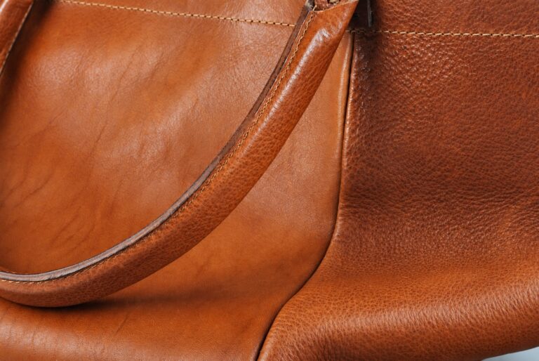 Brown bag grain and stitching illustrating visible details to specify in a product photo brief