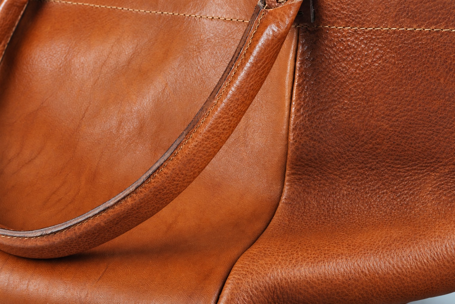 Brown bag grain and stitching illustrating visible details to specify in a product photo brief