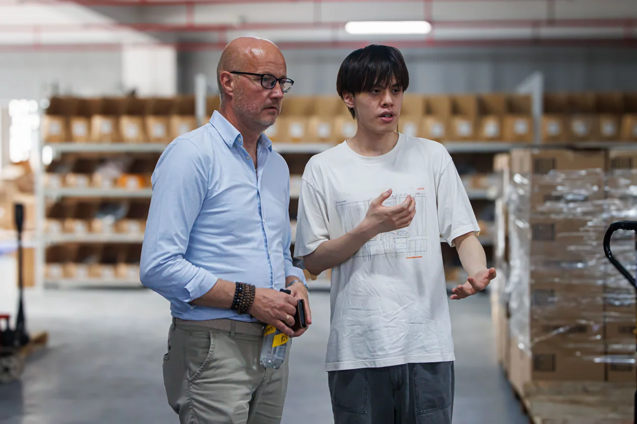 Two people discussing products inside the warehouse